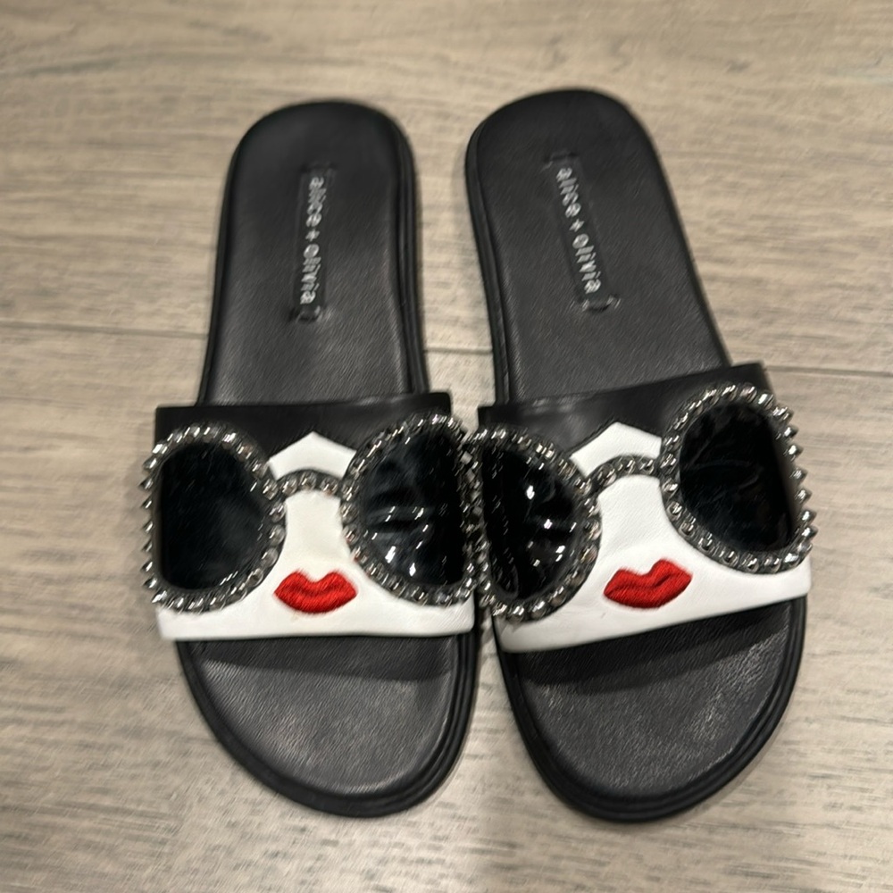 Alice and Olivia sandals. Black and face design.